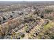 Aerial view of the neighborhood and mature trees, with the city skyline in the distance at 4741 Eaves Ln, Charlotte, NC 28215