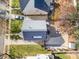 Aerial view of the home with solar panels, backyard patio, and landscaping at 4741 Eaves Ln, Charlotte, NC 28215