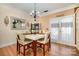 Bright dining room with a modern table, chandelier, and stylish decor at 4741 Eaves Ln, Charlotte, NC 28215