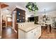 Open kitchen view with custom cabinets, breakfast bar, and seamless flow to the dining area at 4741 Eaves Ln, Charlotte, NC 28215