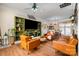 Spacious living room with hardwood floors, built-in shelving, and stylish leather furniture at 4741 Eaves Ln, Charlotte, NC 28215