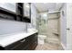 Modern bathroom featuring a glass-enclosed shower, stylish vanity, and sleek fixtures at 4743 Hedgemore Dr # E, Charlotte, NC 28209