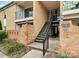 Apartment building exterior with brick facade and wrought-iron staircases, charming entrance at 4743 Hedgemore Dr # E, Charlotte, NC 28209