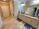 Bathroom featuring double sinks, tile floors, granite countertops, and ample storage space at 6111 Gold Springs Way, Denver, NC 28037