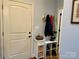 Welcoming entryway featuring a white door, coat hooks, and shoe storage for a tidy entrance at 6111 Gold Springs Way, Denver, NC 28037