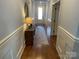 Bright hallway with hardwood floors, decorative molding, and ample natural light at 6111 Gold Springs Way, Denver, NC 28037