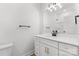 Modern bathroom features white vanity with gold pulls, matte black fixtures and a tiled shower at 615 W Stanly W St, Stanfield, NC 28163