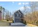 Charming home boasts a two-car garage, covered porch, and beautiful landscaping at 615 W Stanly W St, Stanfield, NC 28163