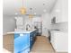 Bright open kitchen features a blue island, stainless appliances, white cabinets, and subway tile backsplash at 615 W Stanly W St, Stanfield, NC 28163