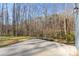 Open patio overlooks a lush wooded area, great for outdoor living and relaxing at 615 W Stanly W St, Stanfield, NC 28163