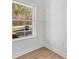 Bright room with window view overlooking the driveway and trees with minimalist white trim and two shelves at 615 W Stanly W St, Stanfield, NC 28163