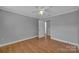 Bedroom features wood floors, neutral walls, and a ceiling fan at 647 Black E St, Rock Hill, SC 29730