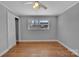 Bedroom features wood floors, neutral walls, ceiling fan and bright natural light from the window at 647 Black E St, Rock Hill, SC 29730