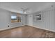 Bright living room features wood-look floors, neutral walls and white ceilings with natural light from two windows at 647 Black E St, Rock Hill, SC 29730