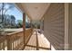 View of the spacious, covered porch showing the wood flooring, rail and siding at 647 Black E St, Rock Hill, SC 29730