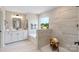 Modern bathroom featuring a soaking tub, walk-in shower, and stylish vanity at 7024 Butternut Oak Ter, Huntersville, NC 28078