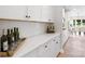 Beautiful kitchen with white countertops, modern cabinets, and a stylish backsplash, showcasing the home's design at 7024 Butternut Oak Ter, Huntersville, NC 28078