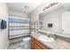 Bathroom featuring a single sink vanity, shower, and toilet at 7360 Winery Ln, Charlotte, NC 28227