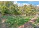 Expansive dog park with lush grass and mature trees offering a fun area for pets at 7360 Winery Ln, Charlotte, NC 28227