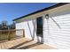 Exterior view of the back deck featuring wood railings, a glass paneled door, and siding at 1018 Union St, Maiden, NC 28650