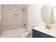 Bathroom featuring tiled shower and vanity with a round mirror at 1018 Union St, Maiden, NC 28650