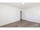 Bedroom featuring neutral paint, wood-look flooring, and natural light at 1018 Union St, Maiden, NC 28650