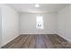 Bright, clean bedroom with hardwood floors and a window providing natural light at 1018 Union St, Maiden, NC 28650