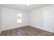 Bright bedroom featuring luxury vinyl plank flooring and white trim at 1018 Union St, Maiden, NC 28650