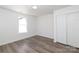 Well-lit bedroom with wood flooring and a double door closet with white doors at 1018 Union St, Maiden, NC 28650