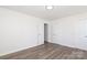 Bright bedroom featuring luxury vinyl plank flooring and white trim at 1018 Union St, Maiden, NC 28650