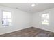 Bedroom featuring wood-look flooring, bright windows, and neutral paint at 1018 Union St, Maiden, NC 28650