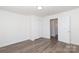 Cozy bedroom with wood flooring, a closet, and a white door leading to the hallway at 1018 Union St, Maiden, NC 28650