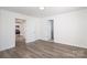 Well-lit bedroom featuring wood flooring, multiple entryways, and neutral decor at 1018 Union St, Maiden, NC 28650