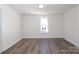 Bedroom featuring luxury vinyl plank flooring, white trim, and ample natural light at 1018 Union St, Maiden, NC 28650