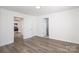 The bright bedroom has modern flooring, neutral paint, and entryways for convenience at 1018 Union St, Maiden, NC 28650