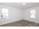 Well-lit bedroom featuring luxury vinyl plank flooring, white trim, and ample natural light at 1018 Union St, Maiden, NC 28650