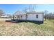 This house features fresh landscaping, a newly renovated facade, and a inviting front porch, creating an inviting curb appeal at 1018 Union St, Maiden, NC 28650