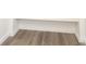 Stylish wood-look flooring under stairs, enhancing the home's modern aesthetic at 1018 Union St, Maiden, NC 28650