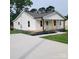 Charming single-story home featuring a welcoming front porch and a well-maintained lawn at 1018 Union St, Maiden, NC 28650