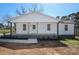 Charming renovated home with a classic white facade, front porch, and fresh landscaping creates instant curb appeal at 1018 Union St, Maiden, NC 28650