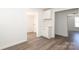 Well-lit hallway featuring wood-look flooring with views to other rooms at 1018 Union St, Maiden, NC 28650