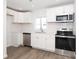 Modern kitchen featuring white cabinets, stainless steel appliances, and a stylish backsplash at 1018 Union St, Maiden, NC 28650