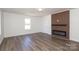 Living room showcases a modern fireplace feature wall and wood-look laminate flooring at 1018 Union St, Maiden, NC 28650