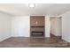 Open living room features a fireplace, stylish flooring, and neutral paint at 1018 Union St, Maiden, NC 28650