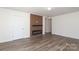 Open living area highlighting a modern fireplace feature wall and wood-look laminate flooring at 1018 Union St, Maiden, NC 28650