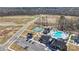 Aerial shot showcases community pool, clubhouse, tennis courts, and parking at 1132 Meander Ln, Waxhaw, NC 28173