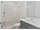 Modern bathroom with a glass-enclosed shower, a gray vanity, and stylish fixtures at 1132 Meander Ln, Waxhaw, NC 28173