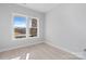 Bright, minimalist bedroom with hardwood floors, large windows, and neutral paint, providing a serene atmosphere at 1132 Meander Ln, Waxhaw, NC 28173