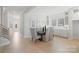 Dining room featuring a wooden table with six upholstered chairs and light wood floors at 1132 Meander Ln, Waxhaw, NC 28173