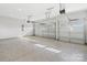 Spacious three car garage featuring an epoxy floor and automatic door openers at 1132 Meander Ln, Waxhaw, NC 28173